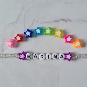 ŁAŃCUSZEK ZŁOTY Z PRZEZROCZYSTYMI KORALIKAMI STARS do okularów przeciwsłonecznych, okularów korekcyjnych, masek lub dowodów osobistych