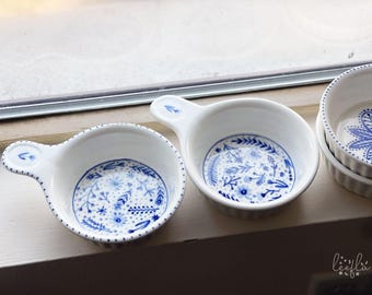 thick ceramic medium bowl with flat handle, blue, orange, floral patterns