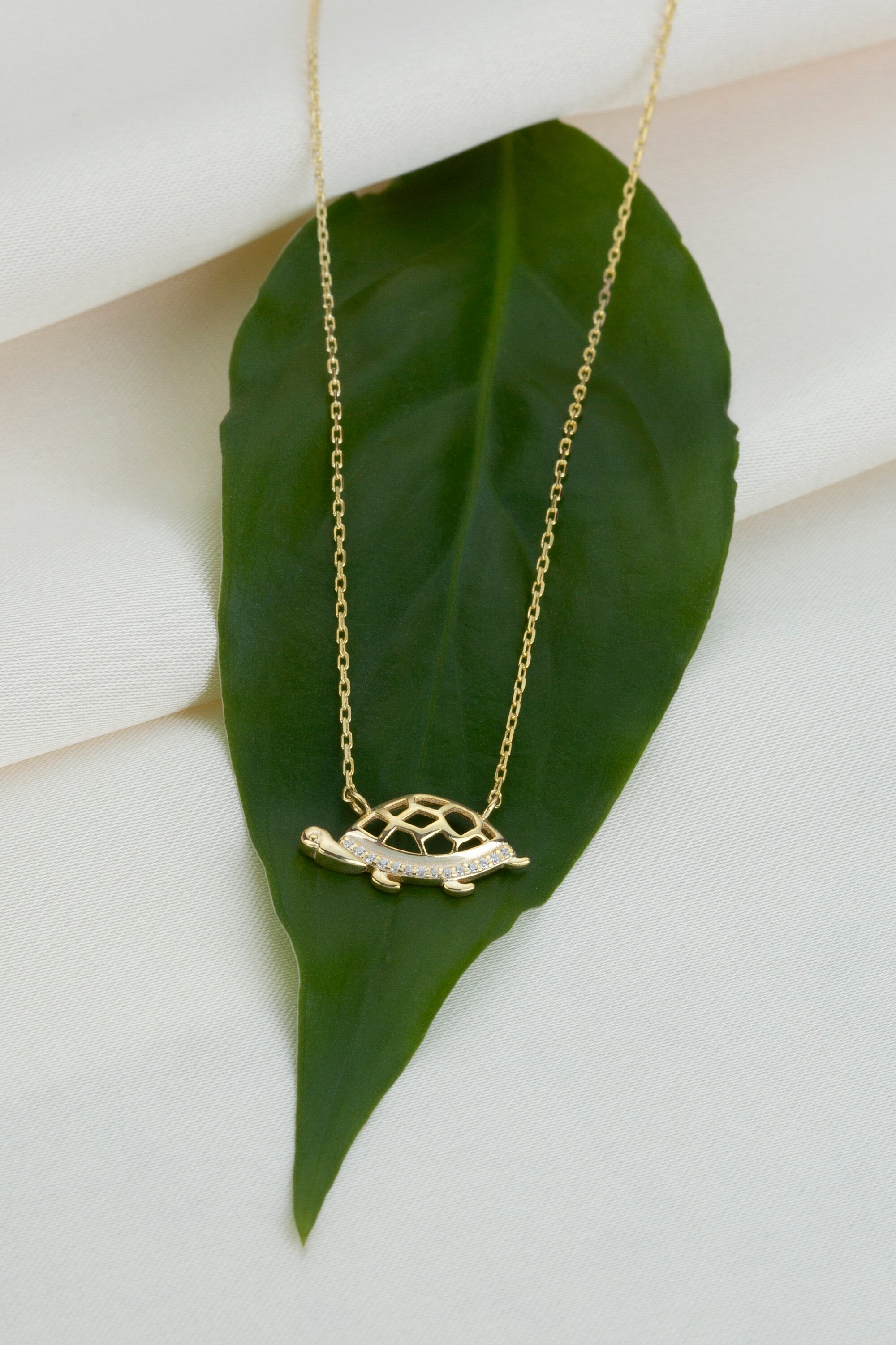 Gold sea turtle necklace discount