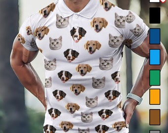 May include: White polo shirt with a repeating pattern of dog and cat faces. The shirt has a button-up collar and short sleeves.