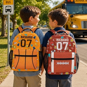 May include: Two backpacks featuring the name RICHARD and the number 07. The left backpack is orange with a basketball pattern and a basketball-textured front pocket. The right backpack is brown with a football pattern and a football-textured pocket.