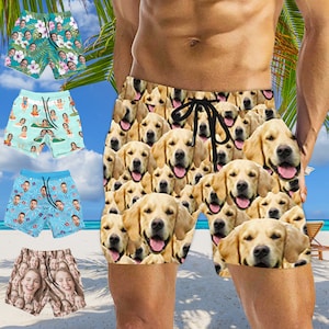 May include: Swim trunks with a repeating pattern of golden retriever faces. The shorts have a black drawstring and are knee-length. Other swim trunks with repeating patterns of faces are also shown, including floral, people, and cartoon designs.