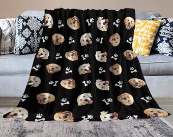 May include: Black fleece throw blanket with a repeating pattern of white paw prints and golden retriever dog faces.