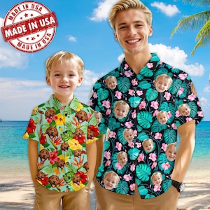 May include: Two matching short-sleeved shirts with a tropical print featuring multiple faces. The shirts are green, black, and pink with a white button closure. The shirts have a "Made in USA" stamp on the left side of the image.