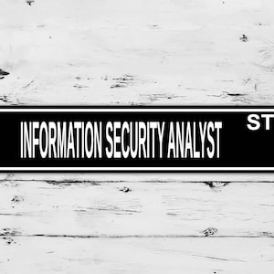 May include: Black and white sign with the text "INFORMATION SECURITY ANALYST ST." on a white wood background.