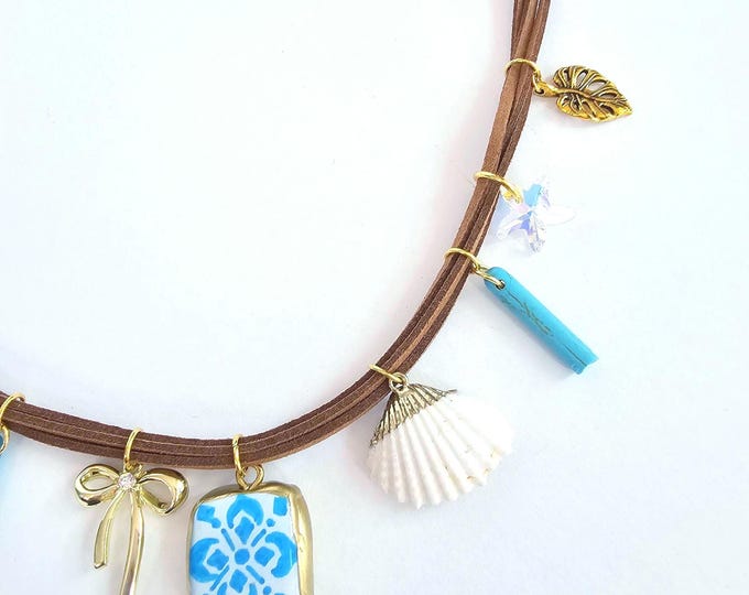 Turquoise Beach Charm Necklace with Blue Tile Pendant, Shell & Gold Bow – Handmade on Brown Suede Cord with Clay Charms