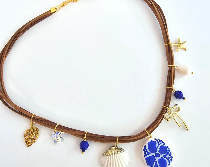 Greek Tile beach Charm Necklace with Hand-Painted Blue Floral Pendant, Shell & Gold Accents – Santorini-Inspired Jewelry on Suede Cord