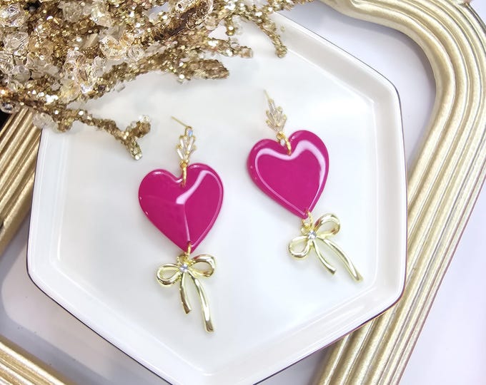 Pink Heart Earrings with Gold Bow Charm - Handmade Resin-Coated Clay Jewelry - Elegant Statement Earrings