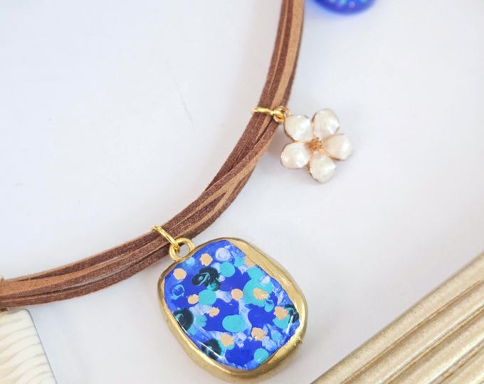 Blue beach Charm Necklace with Confetti like hand painted Pendant, Starfish & Pearls – Handmade on Brown Suede Cord with Clay Accents