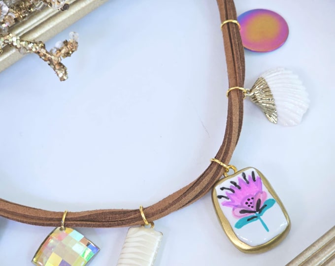 Beach Charm Necklace with painted Pink Floral Pendant, Shell &“Never Give Up” Accent – Handmade on Brown Suede Cord with Clay Charms