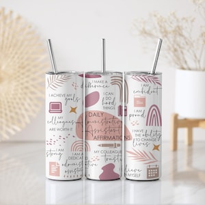 May include: Three white stainless steel tumblers with silver straws. Each tumbler features a unique design with affirmations for an administrative assistant, including text and decorative elements in pink and brown.
