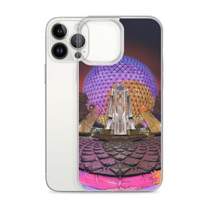 May include: Clear phone case featuring a colorful illustration of a large geodesic sphere with a geometric pattern, a tall, white structure, and a water feature. The background transitions from orange to purple, with a dark sky.