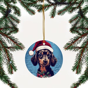 Upgrade your Christmas decor with our 3" ceramic Dachshund ornament featuring an adorable Santa Hat design. Perfect for dog lovers. Limited stock – order now for festive charm!