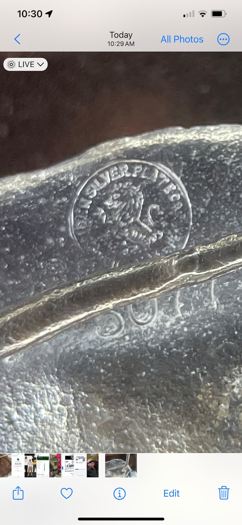 May include: Close-up of a silver-plated item with a lion logo and the words "Silver Plated" inscribed on the surface.
