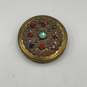 Compacto vintage con joyas