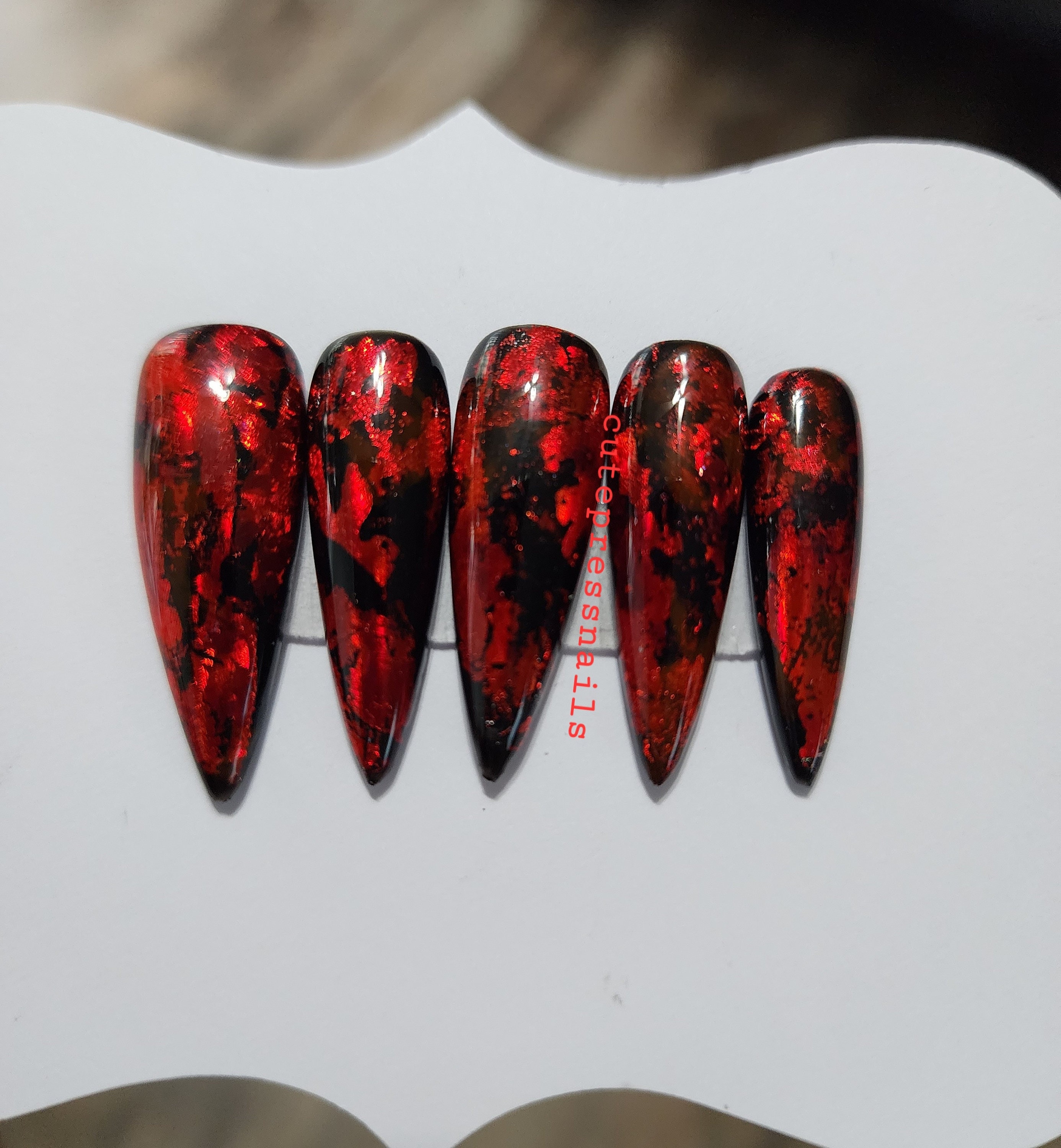 Elegant Red Marble Nail Design