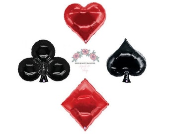 May include: Four red and black foil balloons shaped like playing card suits: hearts, clubs, spades, and diamonds.