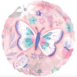 May include: A pink foil balloon with a watercolor design of butterflies and flowers. The main butterfly is purple, pink, and teal.