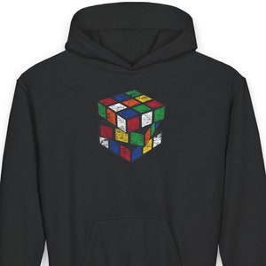 May include: Black hoodie with a vintage-style Rubik's Cube graphic on the front. The cube is made up of different colored squares.