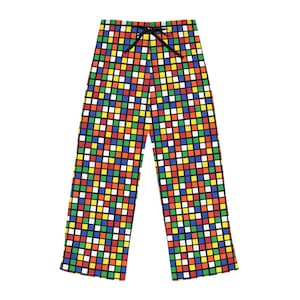 May include: Black pajama pants with a colorful checkered pattern reminiscent of a Rubik's Cube.