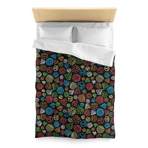 May include: A black duvet cover with a colorful geometric pattern of cubes, spheres, and pyramids. The pattern is made up of thin white lines.