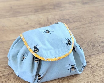 Lay flat makeup/skin care bag - Sophie Allport Bee fabric with mustard lining