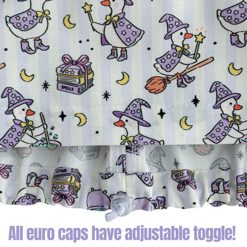 May include: White fabric with a repeating pattern of cartoon geese dressed as witches, wearing purple hats and capes. The design includes moons, stars, and spell books. The text "All euro caps have adjustable toggle!" is at the bottom.
