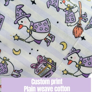May include: A custom print fabric featuring a repeating pattern of cartoon geese dressed as witches, with purple hats and capes, flying on brooms and holding wands. The background has light purple stripes. The text reads "Custom print Plain weave cotton."