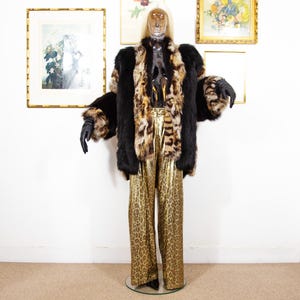 May include: A set of three ceramic mugs with a speckled, matte finish. Each mug features a different color: light blue, cream, and gray. The mugs have a simple, modern design and a comfortable handle.