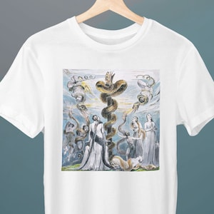 May include: White t-shirt with a print of a painting depicting a snake wrapped around a tree with people standing around it.