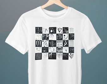 May include: White t-shirt with a black and white graphic print of abstract geometric shapes in a grid pattern.
