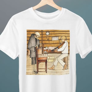 May include: A white t-shirt featuring a vintage illustration of a man in a long coat standing next to a young person playing a violin. The illustration is set in a wooden room with a bed and a clock on the wall.