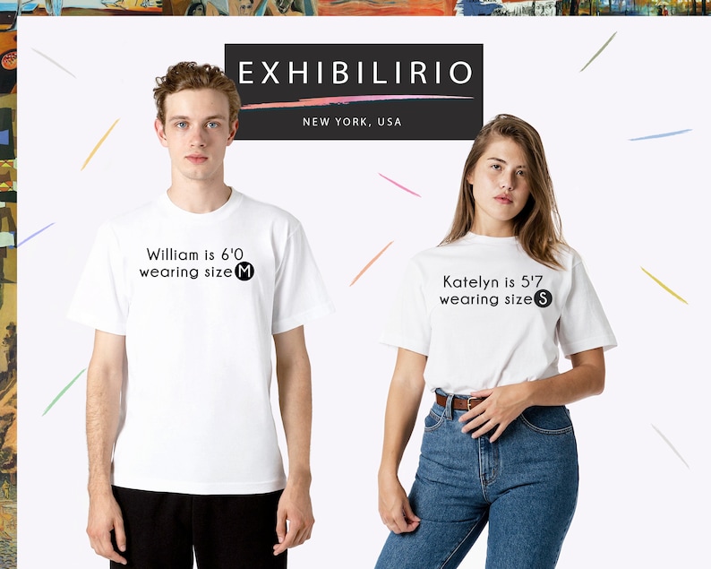 May include: Two people wearing white t-shirts with black text. The text on the shirts reads "William is 6'0 wearing size M" and "Katelyn is 5'7 wearing size S".