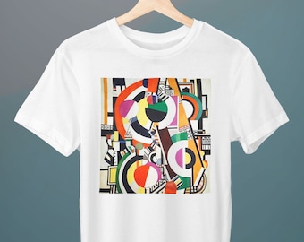 May include: White t-shirt featuring a colourful abstract geometric design with circles, squares and triangles in red, yellow, blue, green, black and white.