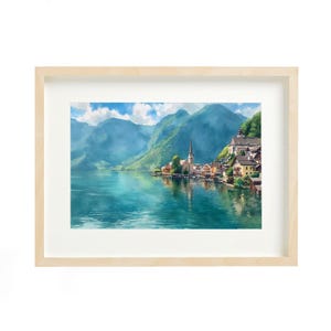 May include: A framed landscape print depicts a serene lakeside village nestled at the foot of majestic mountains. The artwork showcases a vibrant color palette of blues, greens, and yellows, with a light wood frame.