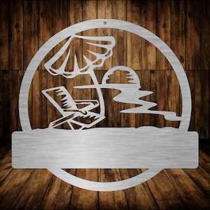 May include: A metal cutout of a beach scene with a beach chair, an umbrella, and a sun. The cutout is attached to a metal plaque with a blank space for personalization.