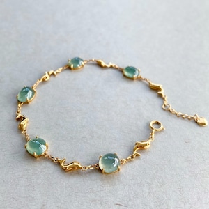 Icy Green Jade Bracelet with 18k Yellow Gold Dolphins Motif