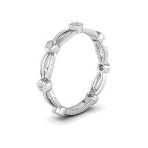 May include: A silver band ring with a delicate design featuring small round diamonds set in the band.
