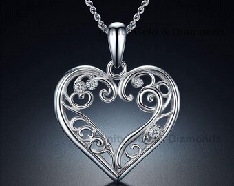 May include: A silver necklace with a delicate, openwork heart pendant featuring a filigree design and small clear stones.