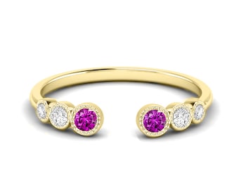 Open manchetring met robijn en zirkonia, 14kt geelgouden afwerking