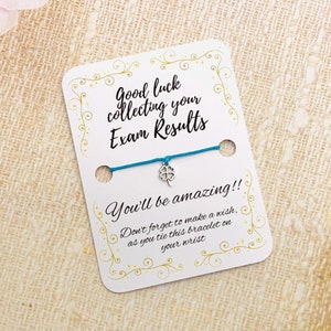 May include: A blue string bracelet with a silver four-leaf clover charm. The card reads "Good luck collecting your Exam Results You'll be amazing!! Don't forget to make a wish as you tie this bracelet on your wrist."