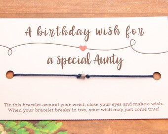 May include: A white card with a blue string bracelet and a silver star charm. The card reads "A birthday wish for a special Aunty". The card also includes instructions for making a wish with the bracelet.