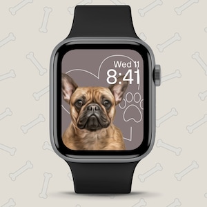 Op de afbeelding: Een zwarte Apple Watch met een grijs gezicht dat de tijd 8:41 en de datum Wo 11 weergeeft. Het horloge heeft ook een cartoonafbeelding van een Franse Bulldog met een hart en een pootprint.