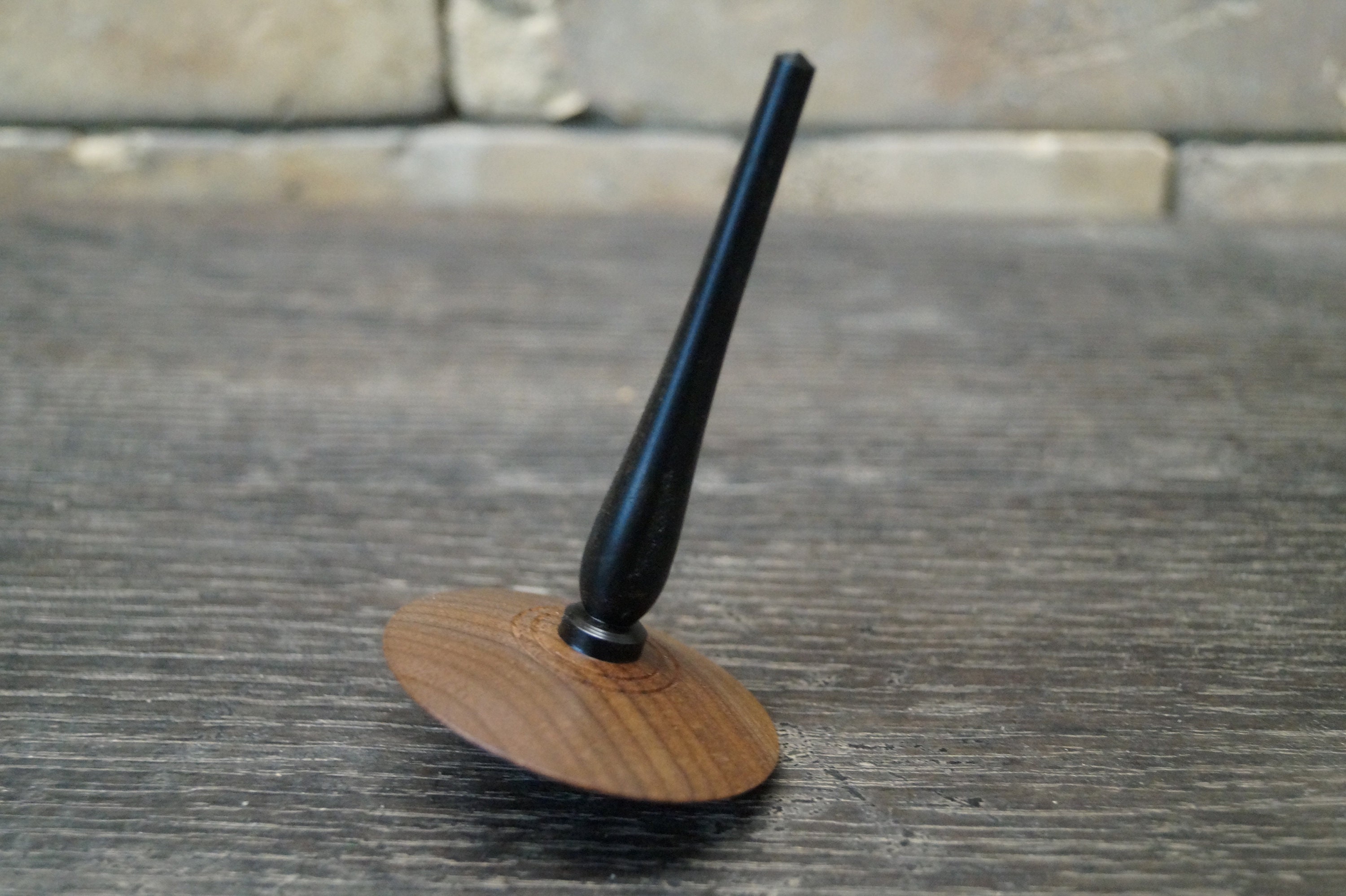 spinning top made of ebony and walnut