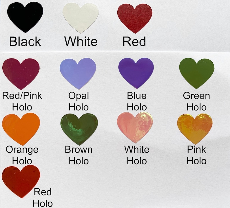 May include: A collection of heart-shaped stickers in various colors, including black, white, red, and holographic shades of red/pink, opal, blue, green, orange, brown, white, and pink. Each heart has a color label.
