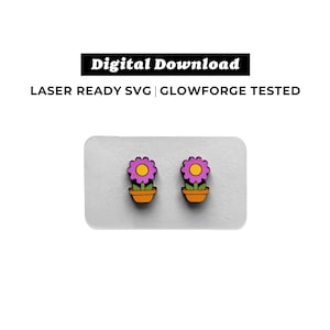 May include: Digital download image of two flower earrings. Each earring features a purple flower with a yellow center in an orange pot. The text "Digital Download" and "Laser Ready SVG | Glowforge Tested" is at the top.