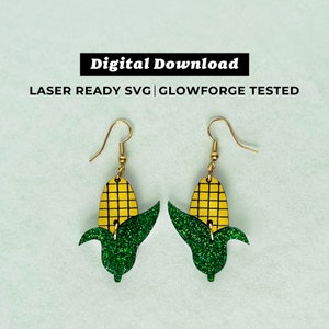 May include: A pair of gold dangle earrings featuring a green glitter corn cob design.  The earrings are laser ready SVG and Glowforge tested.