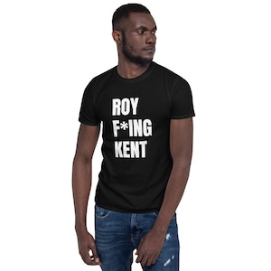 May include: A black t-shirt with white text that reads "ROY F*ING KENT".