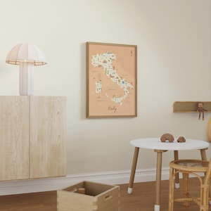 May include: A framed wall art print featuring a map of Italy on a light peach background. The map includes small illustrations of landmarks, food, and regional icons across the country, with the word Italy written in a cursive script at the bottom.