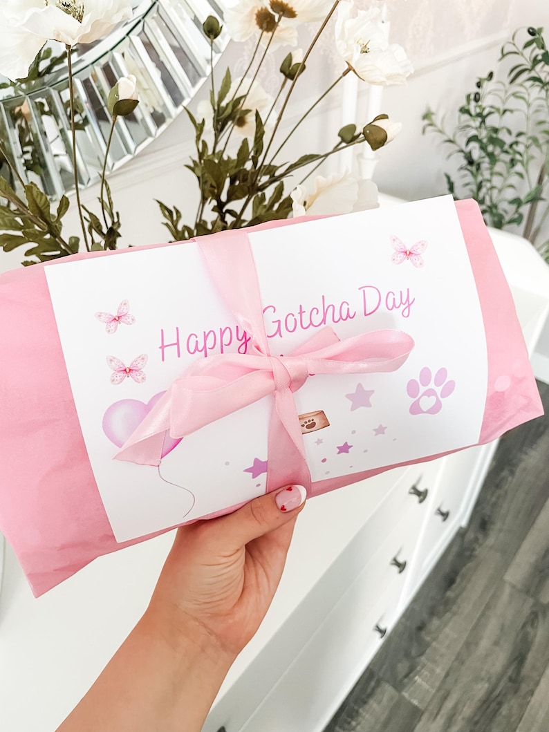 Personalised dog toy gift wrapping option, item wrapped in tissue paper with gift card and satin bow wrapped around to finish, instructions on how to add gift wrap at checkout, customisable gift wrap colours available, dog gotcha day gift.